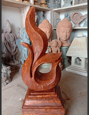 Modern abstract stone sculpture with dynamic movement and expressive carved surfaces