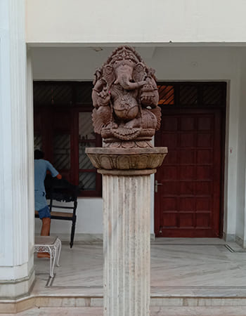 Elegant stone sculpture installation at luxury hotel entrance showcasing traditional craftsmanship