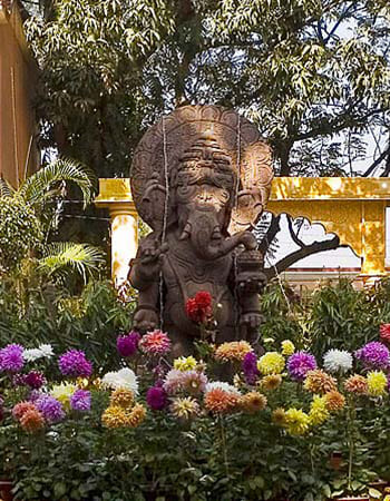 Luxury hotel stone fountain installation with decorative carved elements