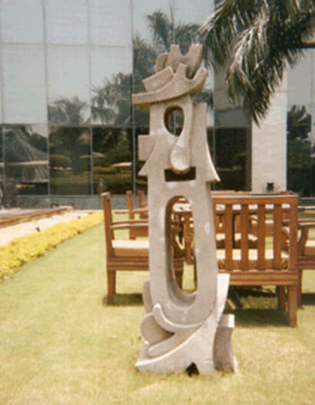 Elegant stone sculpture installation at luxury hotel entrance showcasing traditional craftsmanship