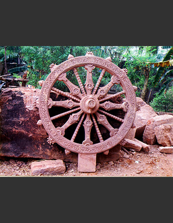Decorative wooden screen with geometric patterns and traditional Odisha tribal motifs