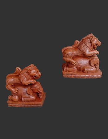 Handcrafted wooden deity sculpture showcasing fine detailing and spiritual symbolism