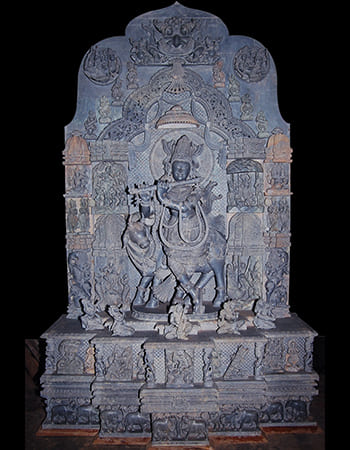 Graceful green stone figurine of a classical dancer with expressive hand gestures and traditional costume