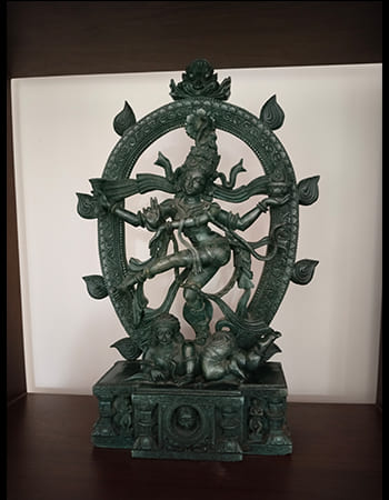 Masterful green stone sculpture of a celestial being with wings and divine ornaments