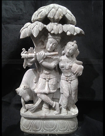 Traditional green stone artwork showcasing Odisha's cultural heritage with religious symbolism