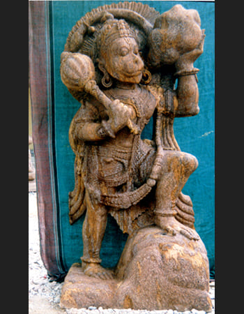 Powerful Lord Hanuman sculpture in sandstone with traditional pose, showcasing divine strength and devotional craftsmanship for spiritual protection