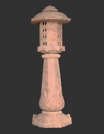 Decorative sandstone light stand featuring traditional Indian architectural elements with detailed carved columns and ornamental top