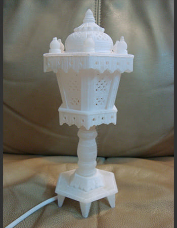 Elegant outdoor lighting solution with handcrafted sandstone pillar design featuring classical proportions and decorative carved accents