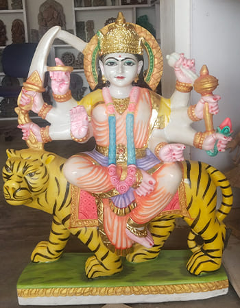 Elegant white marble Saraswati sculpture with veena and lotus seat showcasing traditional Puri marble artistry