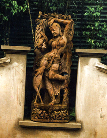 Elegant dancing lady sculpture showcasing classical dance form with flowing garment details