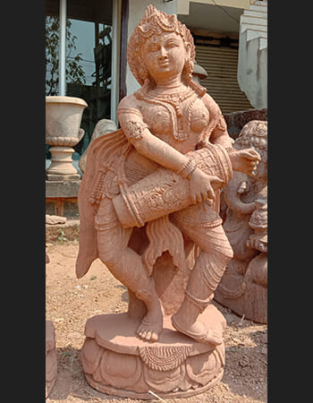 Sandstone dancing lady sculpture with traditional temple art styling and ornate base design