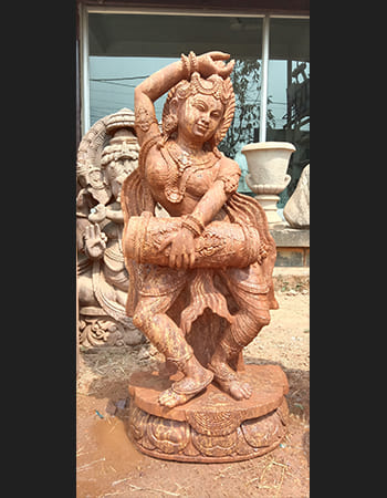 Graceful dancing lady statue in dynamic pose showcasing classical Indian dance form