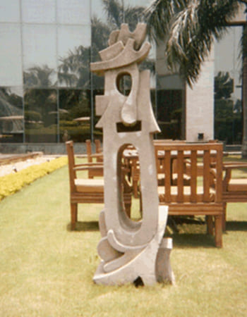 Decorative marble architectural element with pillar design and traditional Kalinga temple motifs