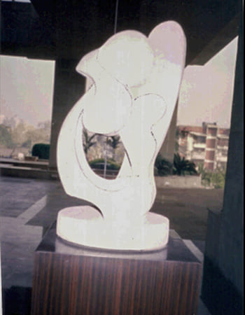 Serene white marble Shiva sculpture in meditation pose with traditional third eye and serpent details