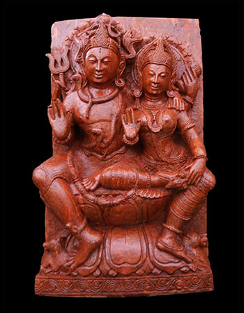 Nataraja Shiva performing cosmic dance within ring of fire, sandstone sculpture depicting creation and destruction cycle