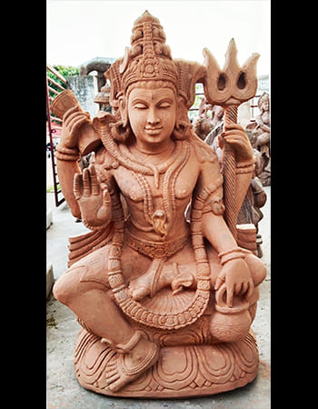 Shiva as Mahadev with third eye and crescent moon, detailed sandstone carving depicting supreme consciousness and time
