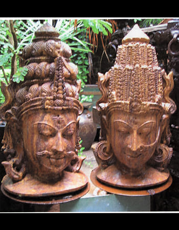 Dancing Shiva with multiple arms holding divine weapons, dynamic sandstone sculpture capturing cosmic energy and movement