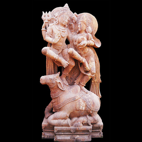 Majestic Lord Shiva sandstone sculpture showcasing divine cosmic dance with trident and damaru, embodying transformation and spiritual power