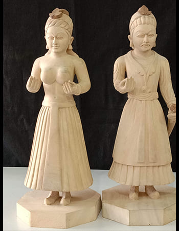 Handcrafted wooden deity sculpture showcasing fine detailing and spiritual symbolism